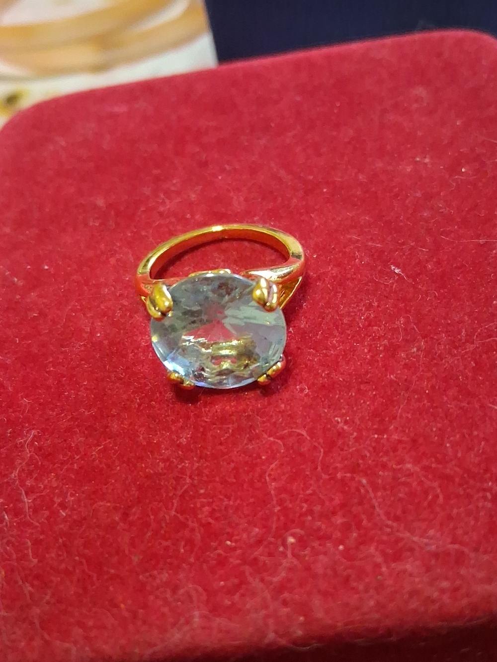 Source Unknown Gold Ring with Light Blue Round Stone